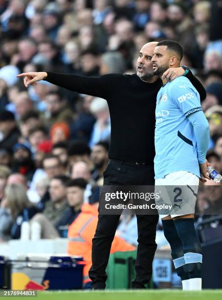 Josep Guardiola, Manager of Manchester City, talks to Kyle Walker of Manchester City during the Premier League match between Manchester City FC and...