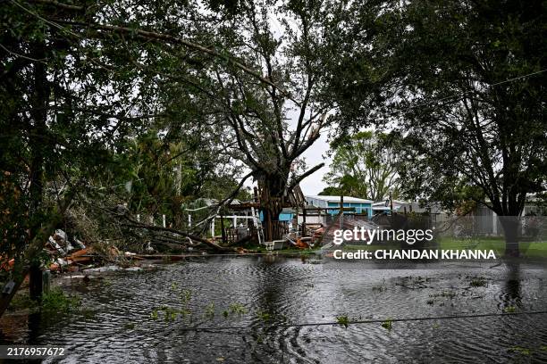 Debris from a destroyed house are seen after it was hit by a reported tornado in Fort Myers, Florida, on October 9 as Hurricane Milton approaches....