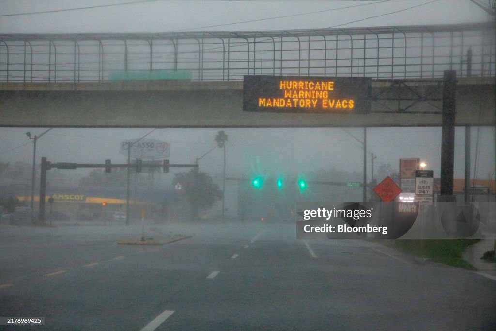 Toppling Sign An evacuation sign during Hurricane Milton in St. Petersburg,... News ...