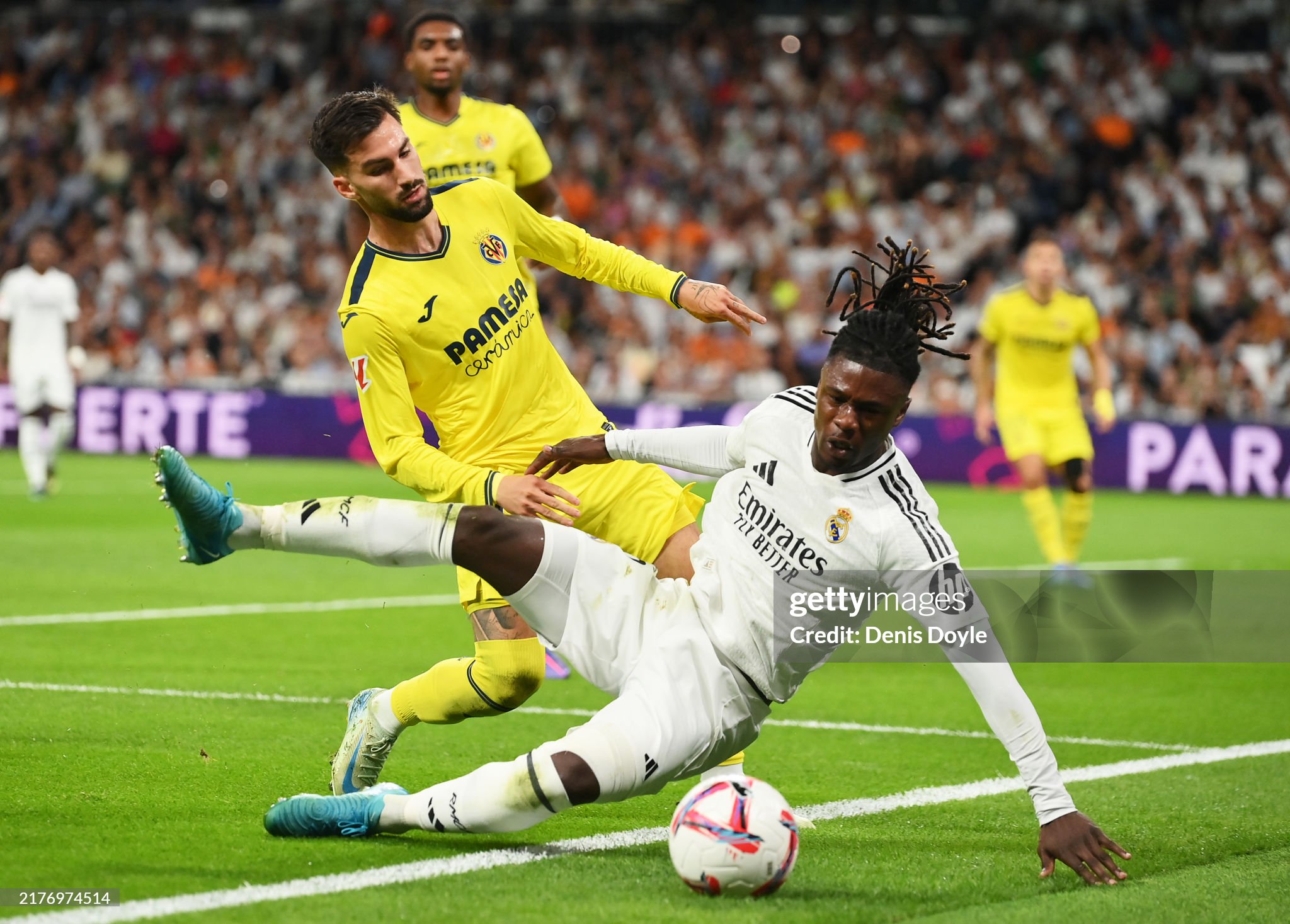 MADRID, SPAIN - OCTOBER 05: Eduardo Camavinga of Real Madrid is challenged by Alex Baena of Villarreal CF during the LaLiga match between Real Madrid CF and Villarreal CF at Estadio Santiago Bernabeu on October 05, 2024 in Madrid, Spain. (Photo by Denis Doyle/Getty Images)