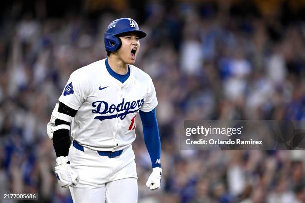 Shohei Ohtani of the Los Angeles Dodgers celebrates a three run home run during the second inning against the San Diego Padres in Game One of the...
