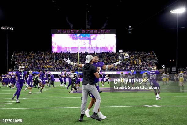 Kamren Fabiculanan of the Washington Huskies celebrates after beating Michigan Wolverines at Husky Stadium on October 05, 2024 in Seattle, Washington.