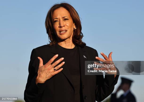 Democratic presidential nominee, Vice President Kamala Harris speaks to the media before boarding Air Force Two after assessing the Hurricane Helene...