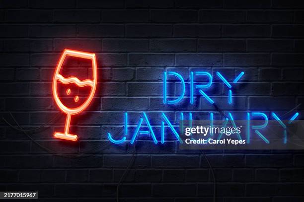 "dry january" text in neon lights - january stock pictures, royalty-free photos & images