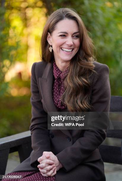 Catherine, Princess of Wales speaks with members of the Emergency Services during a visit to Southport Community Centre on October 10, 2024 in...