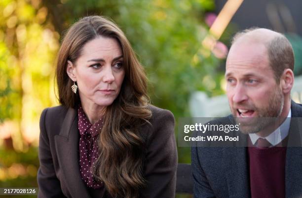 Prince William, Prince of Wales and Catherine, Princess of Wales speak with members of the Emergency Services during a visit to Southport Community...