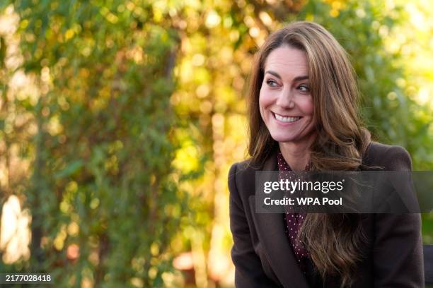Catherine, Princess of Wales speaks with members of the Emergency Services during a visit to Southport Community Centre on October 10, 2024 in...