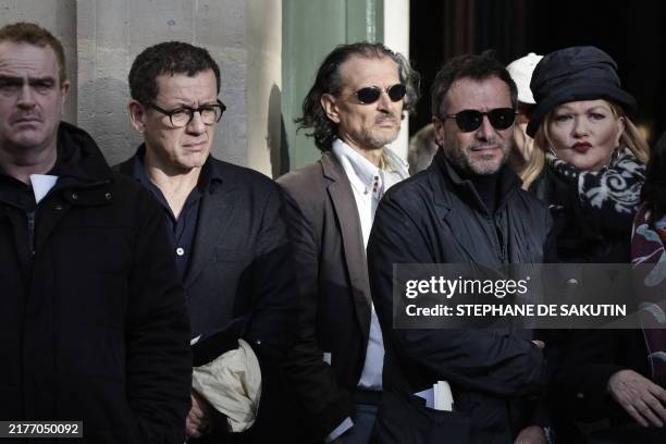 French actor Dany Boon , French actor Bernard Montiel and French actress Catherine Jacob attend the funeral of late French director and actor Michel...