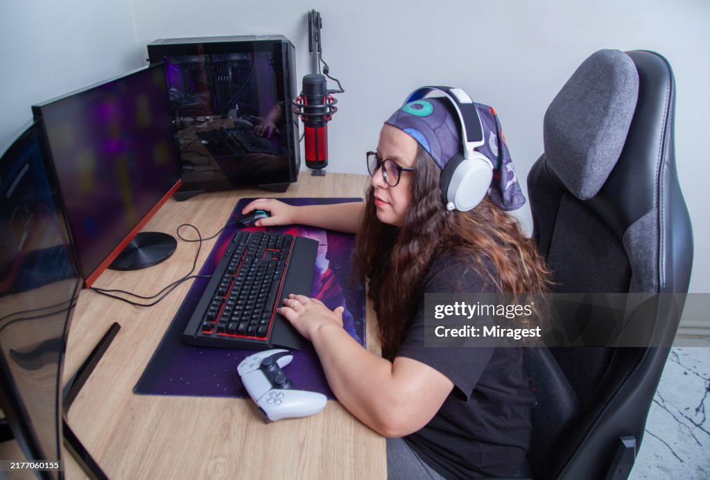 Female gamer playing video game and live streaming