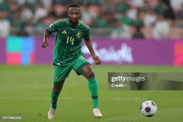 Saudi Arabia's defender Hassan Kadesh dribbles the ball during the 2026 FIFA World Cup Asian qualification football match between Saudi Arabia and...