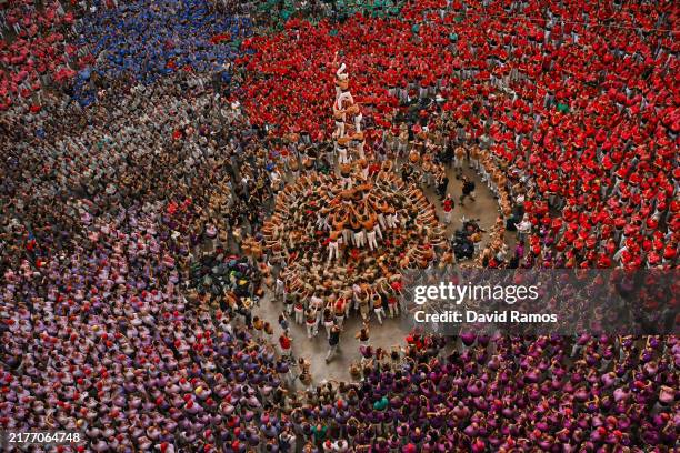 Members of the colla 'Xiquets de Reus' build a human tower during the 29th "Castells" human tower competition on October 06, 2024 in Tarragona,...