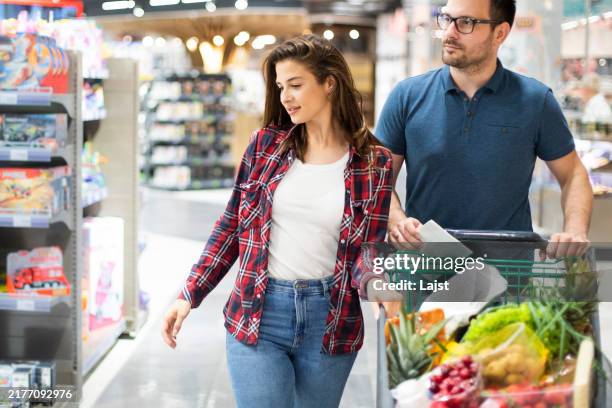 grocery shopping - brown hair stock pictures, royalty-free photos & images