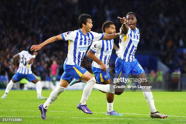 Danny Welbeck of Brighton & Hove Albion celebrates scoring his team's third goal with teammate Kaoru Mitoma during the Premier League match between...