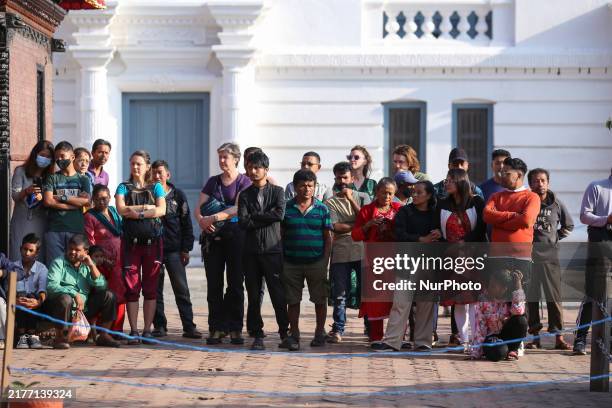 People watch the Maha Nawami procession at Kathmandu Durbar Square in Kathmandu, Nepal, on October 11 the final day of Navaratri.