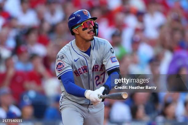 Mark Vientos of the New York Mets hits a three-run home run during the third inning against the Philadelphia Phillies in Game Two of the Division...