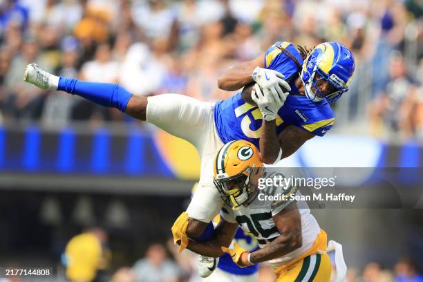 Demarcus Robinson of the Los Angeles Rams secures a catch over Keisean Nixon of the Green Bay Packers during the second quarter at SoFi Stadium on...