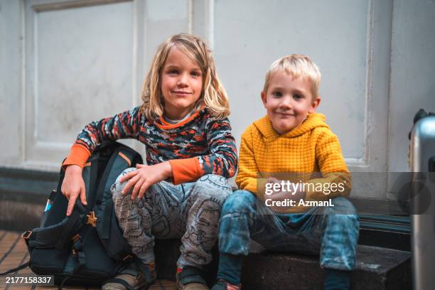 two young boys at train station - scandinavia stock pictures, royalty-free photos & images