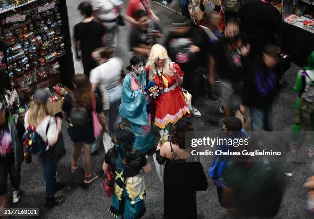 Cosplayers pose for a photo during 2024 Los Angeles Comic Con at Los Angeles Convention Center on October 06, 2024 in Los Angeles, California.