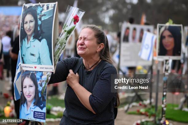 Woman breaks down at the memorial to Yulia Waxer Daunov as family members and friends of the lost and kidnapped gather at the site of the Nova...