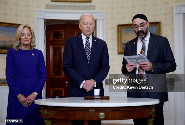 President Joe Biden participates in a remembrance ceremony with first lady Jill Biden and Rabbi Aaron Alexander of Adas Israel Congregation on the...