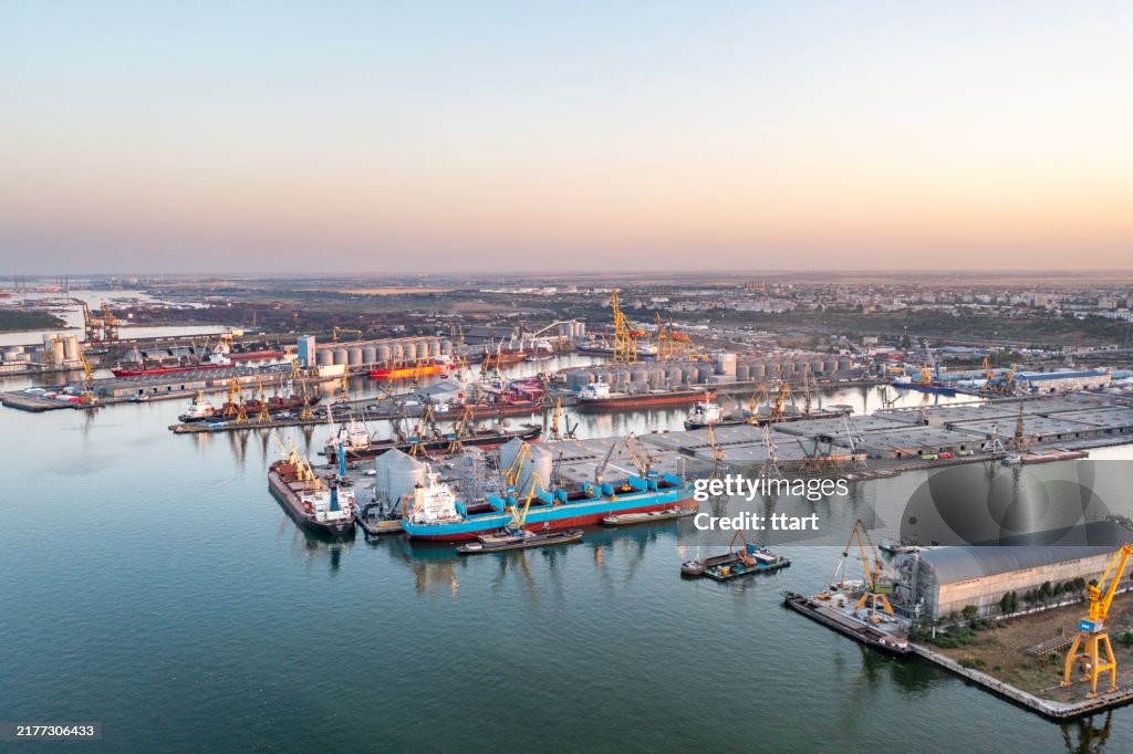 Aerial top view of Constanta port, container ship in export and import business and logistics in Romania