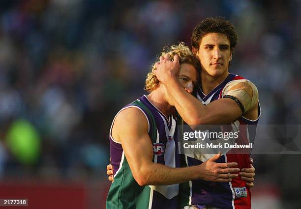 Shaun McManus and Matthew Pavlich of the Dockers console one another after losing the round 15 AFL match between the Collingwood Magpies and the...