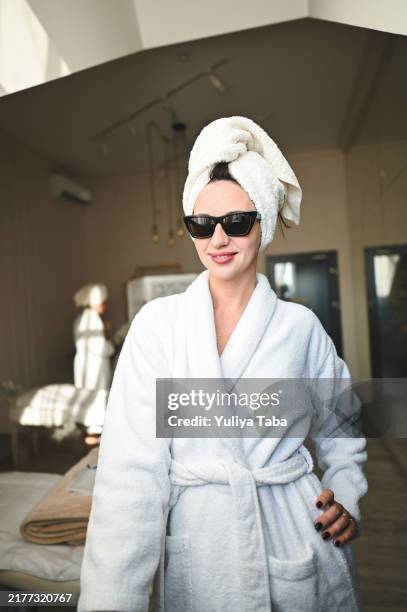 portrait of a young female at bachelorette party in a spa. - bathrobe stock pictures, royalty-free photos & images
