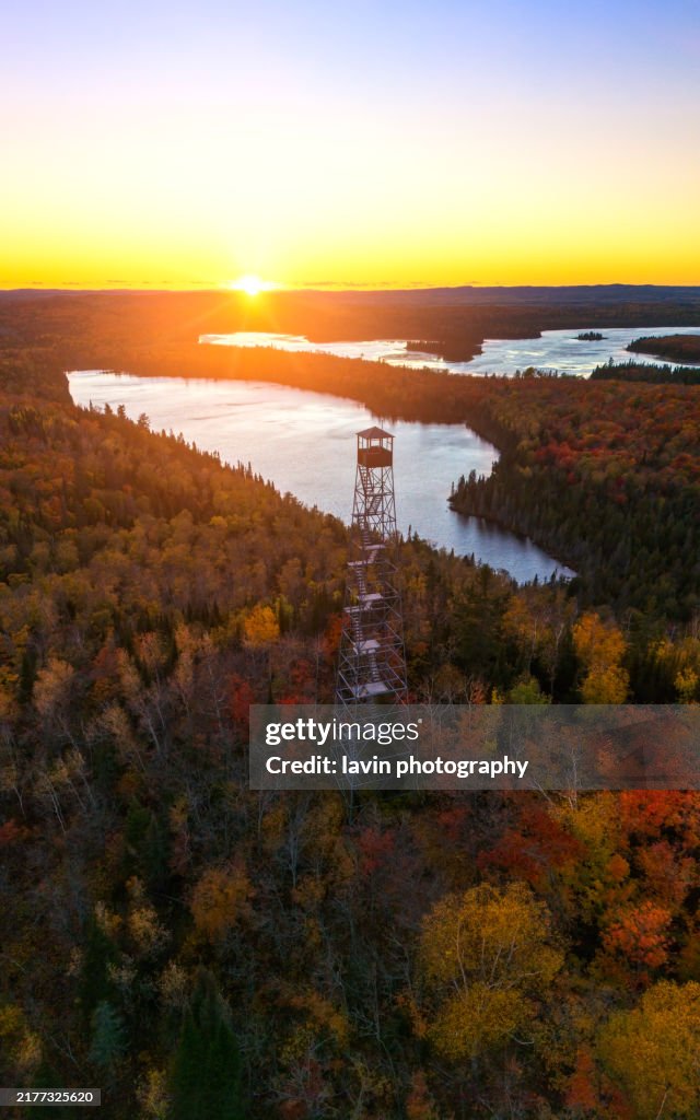 Fall colors with a firetower and lake