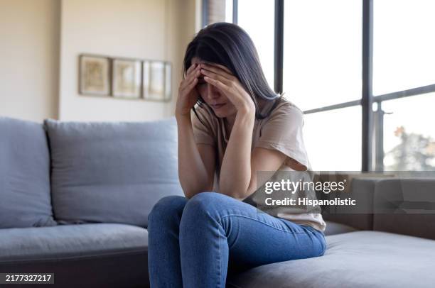 woman with depression at home - hands covering eyes stock pictures, royalty-free photos & images