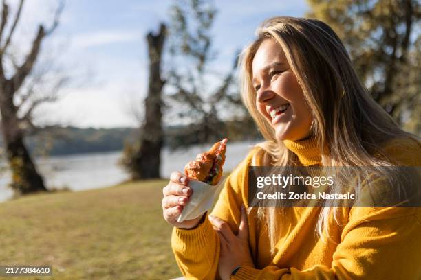a peaceful morning with a croissant - autumn lake chair stock pictures, royalty-free photos & images