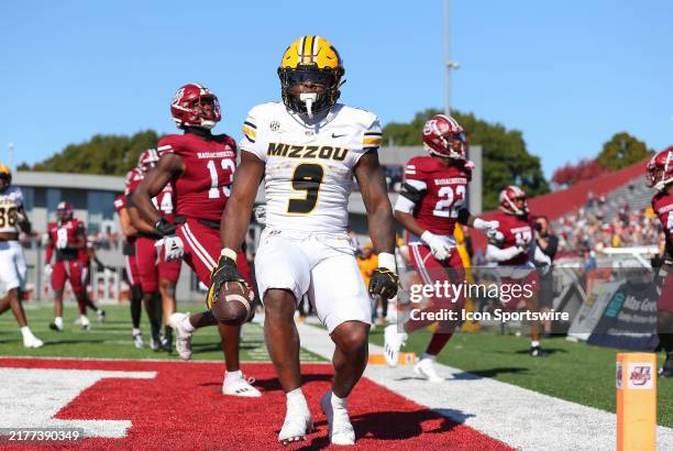 Missouri Tigers running back Marcus Carroll reacts after scoring a touchdown during a college football game between Missouri Tigers and UMass...