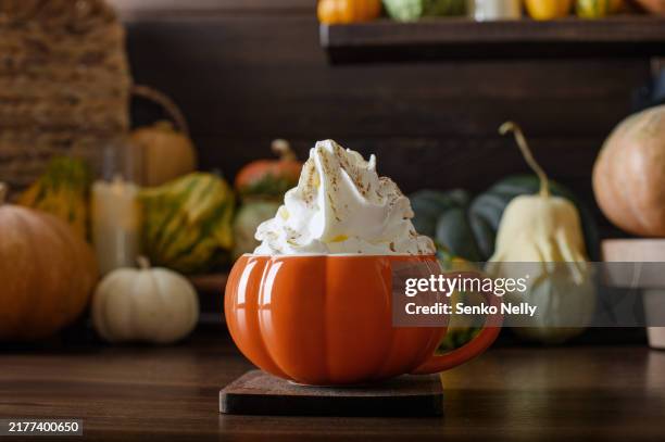 pumpkin cup on background with various pumpkins - pumpkin stock pictures, royalty-free photos & images