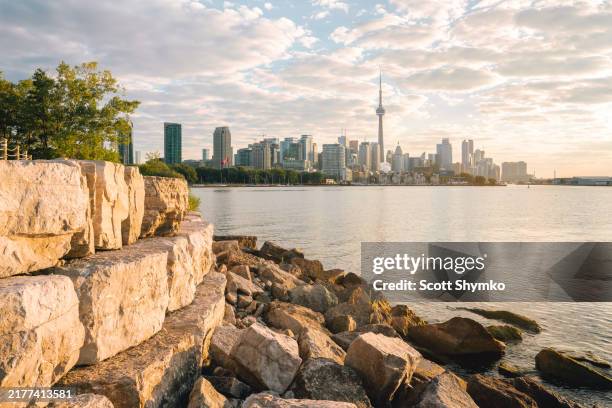 early light falls on toronto's downtown core - toronto waterfront stock pictures, royalty-free photos & images