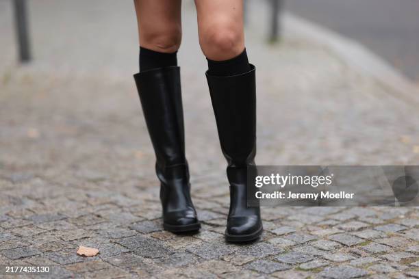 Sonia Lyson is seen wearing black knee-high socks from Wolford, paired with knee-high black leather boots from Zara on October 07, 2024 in Berlin,...