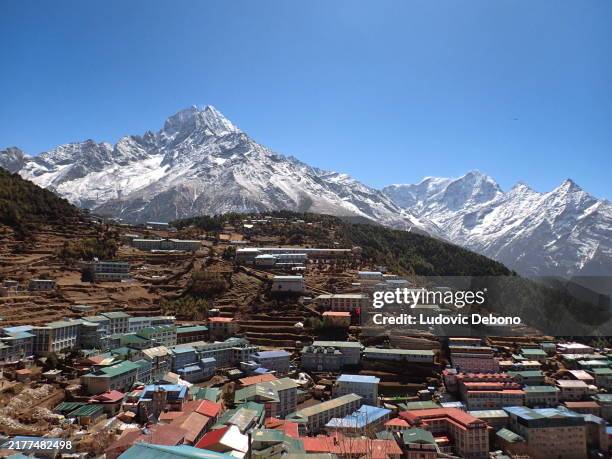 landscape with namche bazar and thamserku mountain in the sagarmāthā national park - namche bazaar stock pictures, royalty-free photos & images