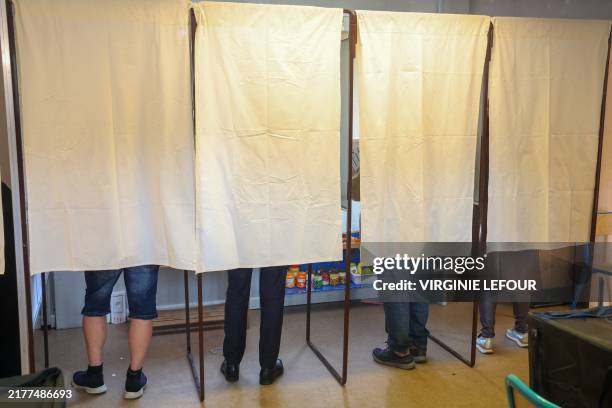 Chairman Georges-Louis Bouchez casts his vote at a polling station in Mons, Sunday 13 October 2024. Belgium holds local elections to elect new...