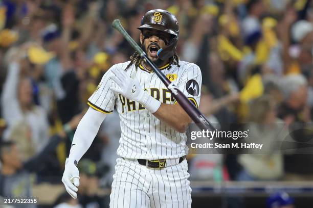 Fernando Tatis Jr. #23 of the San Diego Padres tosses his bat after hitting a home run in the second inning against the Los Angeles Dodgers during...