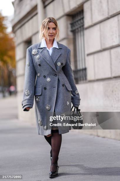 Veronica Ferraro wears white buttoned up long sleeve shirt, dark gray double breasted tailored Miu MIu blazer coat with silver embroidered detail,...