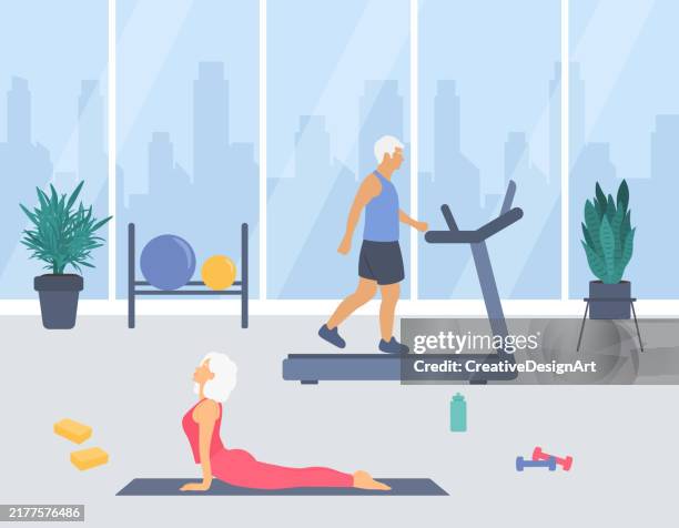 fitnessraum-interieur mit sportlichem seniorenpaar. älterer mann, der auf laufband geht, und ältere frau, die yoga-übungen durchführt. gesundes lebensstil-konzept - fitnessraum stock-grafiken, -clipart, -cartoons und -symbole
