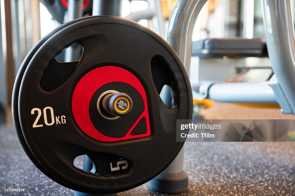 Close-up of 20 kg weight plate in gym