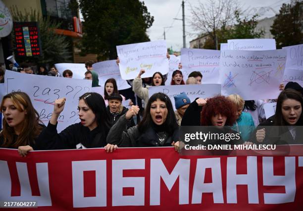 Protesters take part in a demonstration against Moldovan President and candidate to re-election Maia Sandu and against Moldova's adhesion to the...