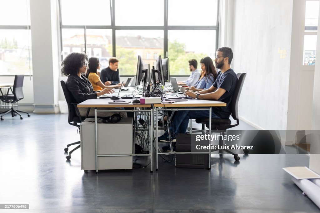 Diverse business people working at coworking office space