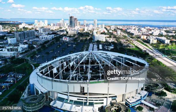 In this aerial view, the domed roof at Tropicana Field, the home of the Tampa Bay Rays, is seen ripped to shreds from Hurricane Miltonís powerful...