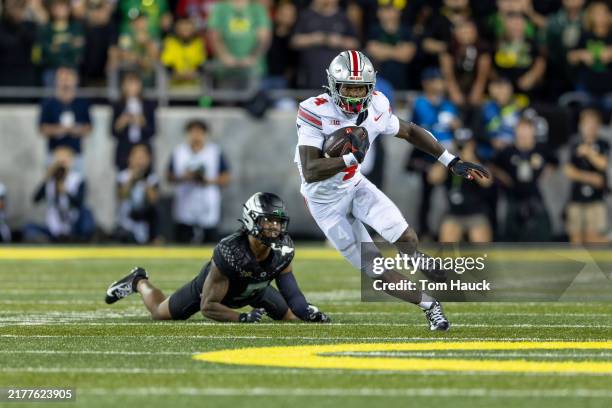Wide receiver Jeremiah Smith of the Ohio State Buckeyes runs against the Oregon Ducks at Autzen Stadium on October 12, 2024 in Eugene, Oregon.