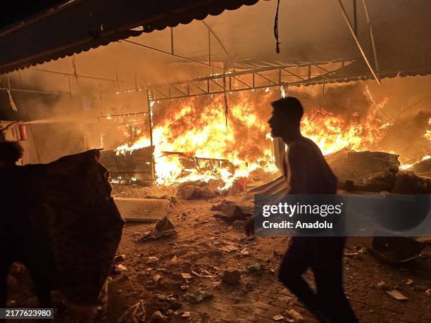 Fire breaks out on the tents housing displaced civilians after Israeli attacks in the courtyard of Al-Aqsa Martyrs Hospital in Deir Al Balah, Gaza on...