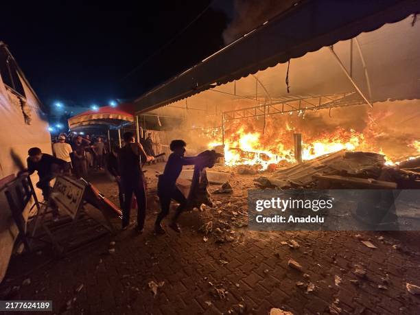Fire breaks out on the tents housing displaced civilians after Israeli attacks in the courtyard of Al-Aqsa Martyrs Hospital in Deir Al Balah, Gaza on...