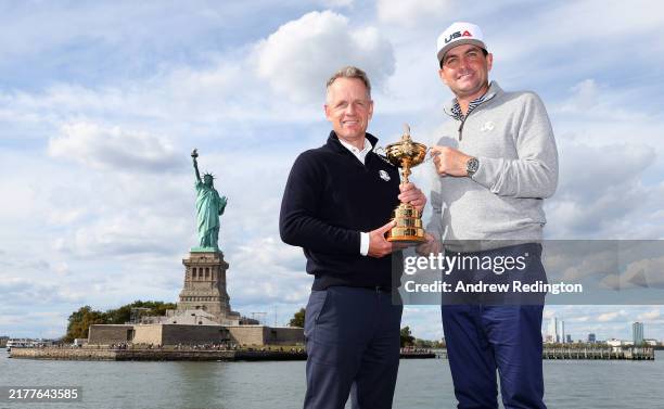Team Captains Luke Donald of England and Keegan Bradley of The United States pose for a photograph with the Ryder Cup Trophy during the Ryder Cup...