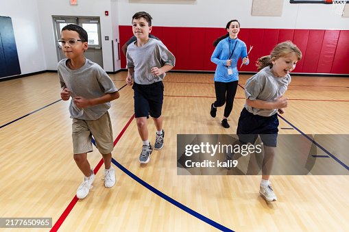 Elementary students taking physical education class Elementary students taking physical education class