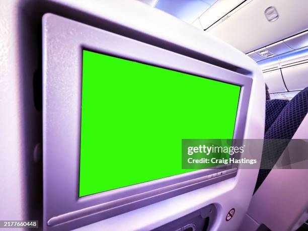dubai to london airplane green screen - long haul large airplane back of seat in flight entertainment system or airport environment targeting adverts at consumers, flight shoppers, commuters, passenger and tourists - digital billboard london stock pictures, royalty-free photos & images