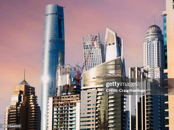 dubai, uae - close up of modern real estate luxury apartment buildings in residential areas popular with expats and professionals. - dubai marina stock pictures, royalty-free photos & images